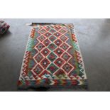 An approximately 5'3" x 3'2" Chobi Kelim rug