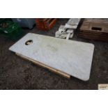 A large piece of granite with sink hole cut, measu