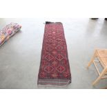 An approximately 8' x 2' Meshwani runner