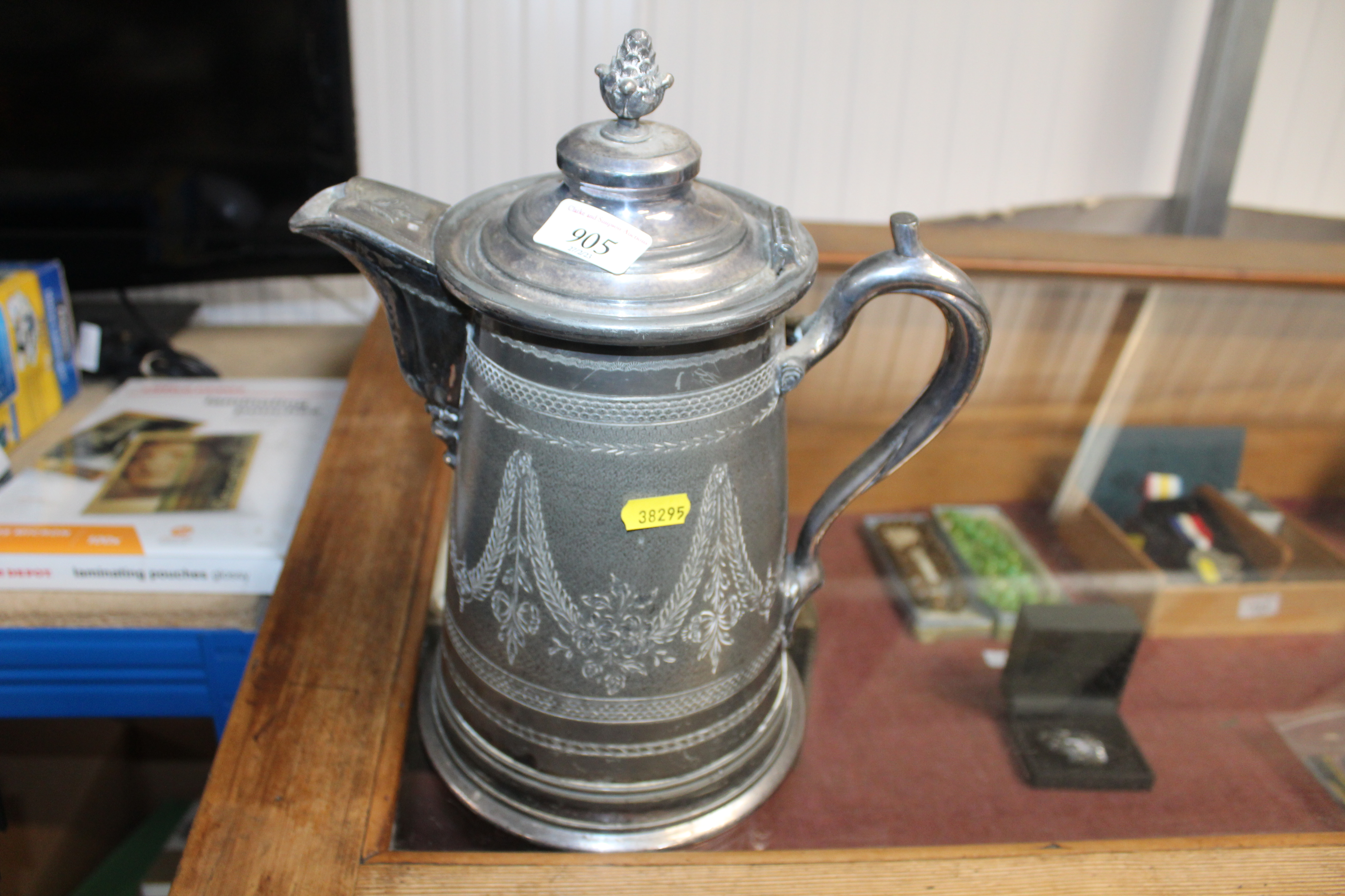 A large silver plated lidded jug