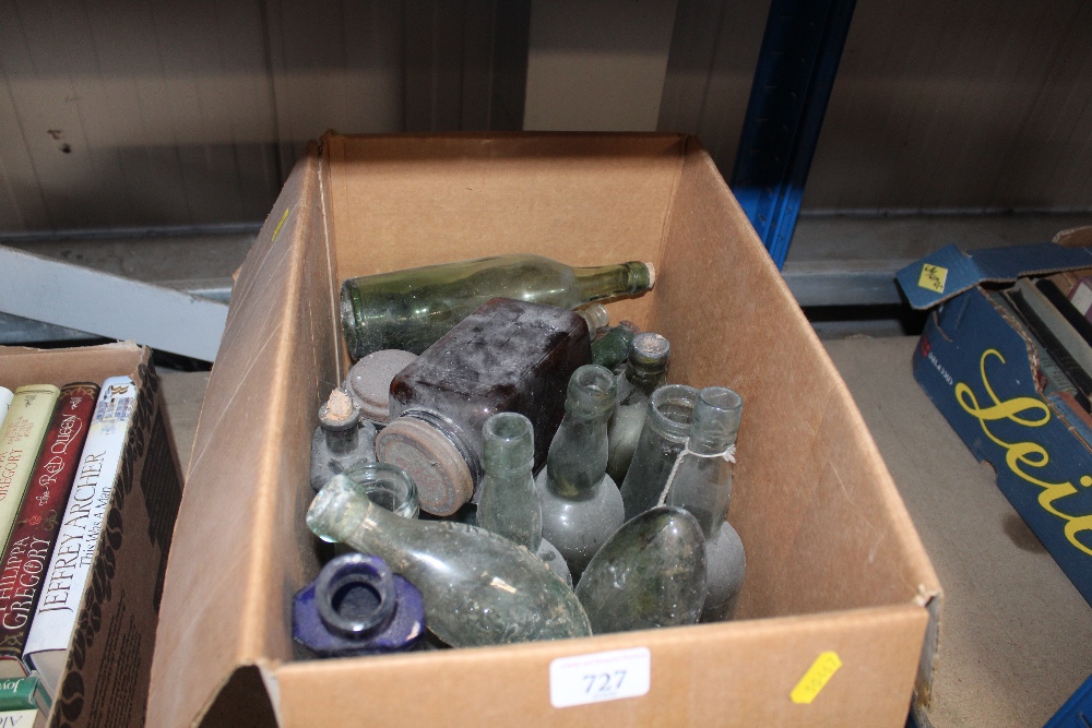 A box containing various glass bottles