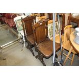 A pair of oak gothic style chairs