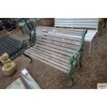 A wooden and metal garden bench