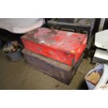 A red metal box and vintage ammunition box
