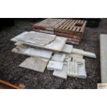 A quantity of marble slabs and decorative pieces