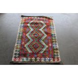 An approximately 4' x 2'6" Chobi Kelim rug