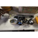 Three fishing reels; landing net; lead weights etc