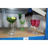 A quantity of coloured glass wine glasses, two Cra
