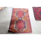 An approximately 4'5" x 2'7" Bolochi rug