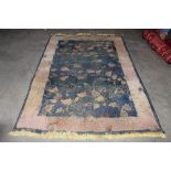 An approx. 7'7" x 5'2" floral patterned rug