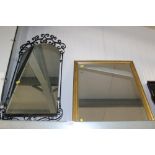 A wrought iron framed mirror together with a gilt