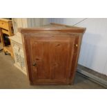 A pine corner cupboard