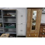 A modern white cupboard fitted single drawer