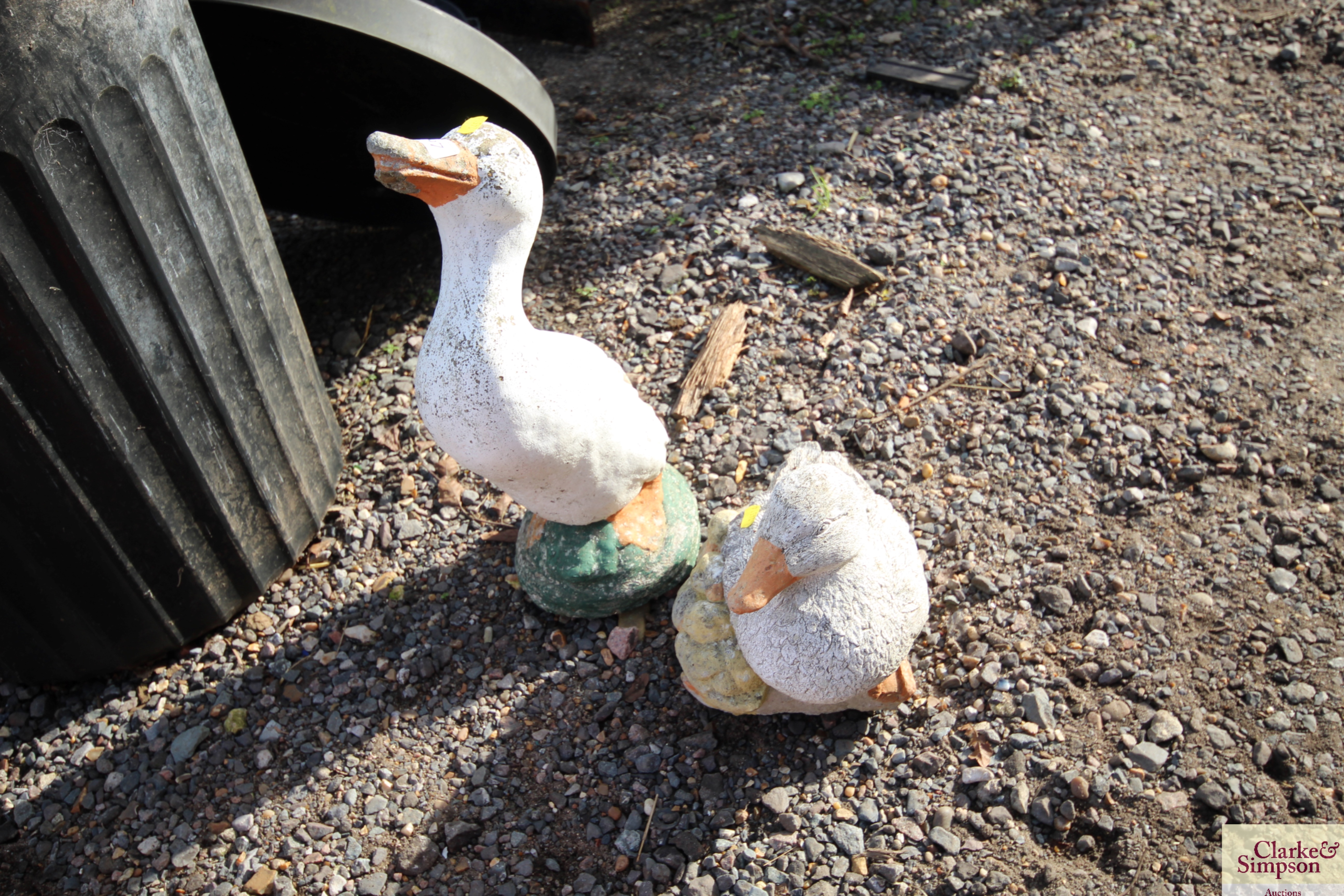 Two concrete garden ornaments in the form of ducks