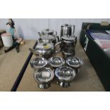 A quantity of stainless steel teapots, dishes etc.