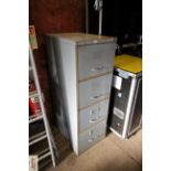 A metal four drawer filing cabinet