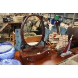 A mahogany swing framed mirror raised on box base