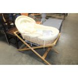 A Moses basket on stand