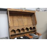 A pine wall hanging storage rack