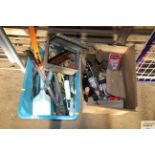 A plastic box with contents of various garden tool