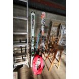 A pair of Salomon X-Drive skis; a pair of Head Sup