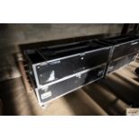 A large flight case on castor base, divided into four compartments, measuring approx. 22" x 60" x