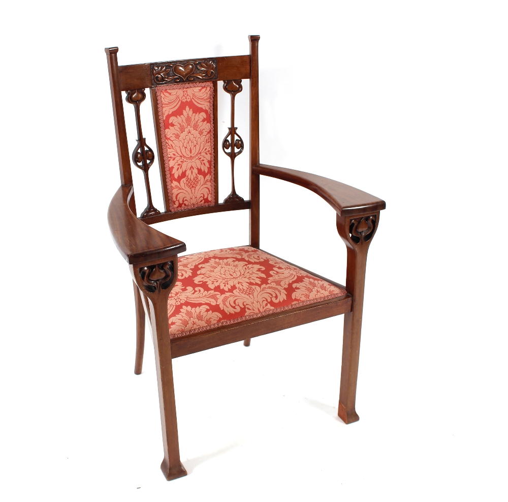 An Art Nouveau Liberty style carved mahogany three