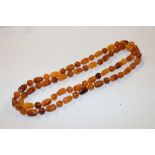 An amber coloured bead necklace