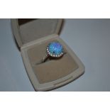 A large sterling silver and opal CZ dress ring, si