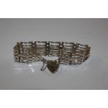 A silver gated bracelet with padlock clasp