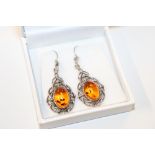 A pair of sterling silver and amber art nouveau style drop earrings