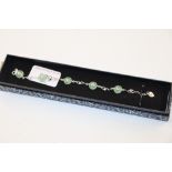 A 925 and jade coloured set bracelet, boxed