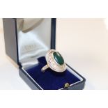 A large vintage silver and jade set ring, size ST