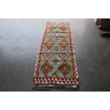 An approx. 5'8" x 2'3" Chobi Kilim rug