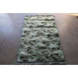 An approx. 5'3" x 3' modern wool rug