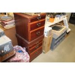 A pair of bedside chests fitted two drawers