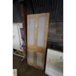 A pine four panel internal door