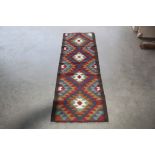 An approx. 5'8" x 1'9" Maimane Kilim rug