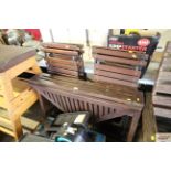 A wooden garden drop leaf folding table and four folding wood and metal slatted garden chairs