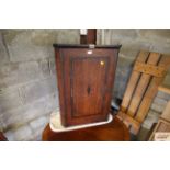 A Victorian corner cupboard with key