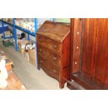 A Georgian bureau fitted three long drawers