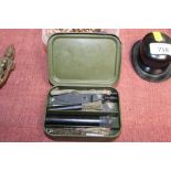 A military rifle cleaning kit dated 1973