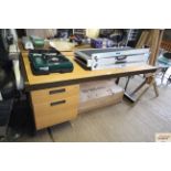 A wooden and metal framed two drawer writing desk