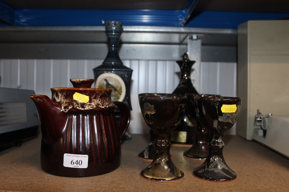 A Honiton Studio Pottery teapot, a liqueur set and