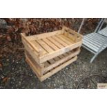 Three wooden apple crates