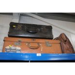 Two vintage suitcases and a a leather satchel