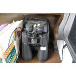 A pair of Sakura binoculars with carry case