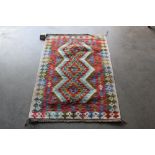 An approx. 4'6" x 2'6" Chobi Kilim rug