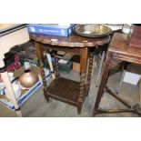 An oak pie crust topped table raised on barley twi