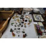 A collection of miniature animal ornaments and two